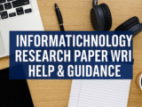Professional academic workspace with laptop, research data, and digital charts representing Information Technology research paper writing help and guidance by Qundeel.com